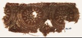 Textile fragment with star-shaped flowers in dotted circles (EA1990.566)