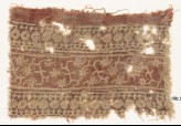 Textile fragment with bands of circles, arches, stars, tendrils, and rosettes (EA1990.595)