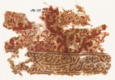 Textile fragment with Persian script and floral shapes