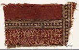 Textile fragment with plants, half-medallions, and bands of rosettes (EA1990.603)