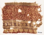 Textile fragment with stylized plants, half-medallions, rosettes, and crenellations (EA1990.608)