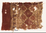 Textile fragment with grid of squares and rosettes (EA1990.609)