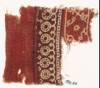 Textile fragment with bands of dotted circles, curves, and crossed tendrils (EA1990.616)