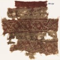Textile fragment with bands of crossed tendrils, rosettes, and linked squares (EA1990.632)