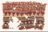 Textile fragment with bands of tendrils, rosettes, and crenellations (EA1990.633)