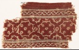 Textile fragment with medallions, rosettes, and vines (EA1990.640)