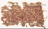 Textile fragment with interlacing vines, leaves, and flower-heads