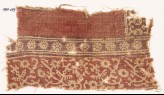 Textile fragment with stylized plants, crossed tendrils, and flowers