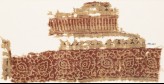 Textile fragment with an ornate vine, flower-heads, and triangles