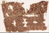 Textile fragment with interlace and interlocking rosettes