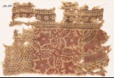 Textile fragment with plants and rosettes