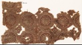 Textile fragment with linked circles and stars (EA1990.726)