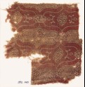 Textile fragment with linked cartouches and medallions (EA1990.740)