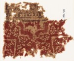 Textile fragment with half-medallion, parts of squares, and flowers