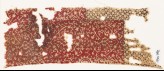 Textile fragment with oval medallions and petals or grains