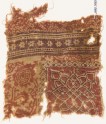 Textile fragment with interlace, floral pattern, and rosettes (EA1990.790)