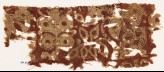 Textile fragment with stylized plants (EA1990.816)