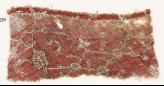 Textile fragment with interlacing tendrils, rosettes, and flower-heads (EA1990.836)