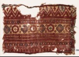 Textile fragment with bands of quatrefoils, rosettes, and chevrons (EA1990.907)