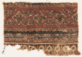 Textile fragment with diamond-shapes, circles, and arches (EA1990.917)