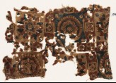 Textile fragment with squares, rosettes, and flower-heads (EA1990.977)