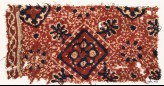 Textile fragment with square, flower-heads, rosettes, and medallions (EA1990.990)