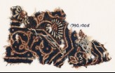 Textile fragment with curving tendril, leaves, and a flower (EA1990.1006)