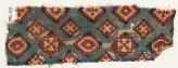 Textile fragment probably imitating patola pattern, with diamond-shapes and crosses