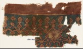 Textile fragment with linked hearts and arches (EA1990.1030)