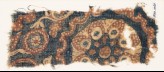 Textile fragment with tendrils, circles, and flower