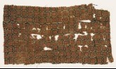 Textile fragment with linked circles and rosettes (EA1990.1102)