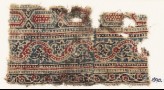Textile fragment with bands of elongated hexagons and vines
