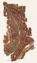 Textile fragment with part of a large leaf, tendrils, and bunches of fruit (EA1990.1140)