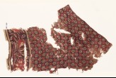 Textile fragment with circles, and naturalistic fruit and flowers