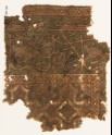 Textile fragment with flower-heads, diamond-shape, and inscription (EA1990.1190)