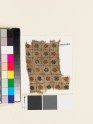 Textile fragment with grid of rosettes