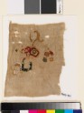 Textile fragment with incomplete floral shapes