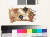 Textile fragment with floral shapes and possibly fish