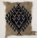 Textile fragment with hands and diamond-shaped medallion