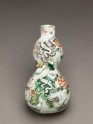 Wall vase with flowers and tendrils in high relief