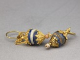 Gold earrings with lapis lazuli, ivory, and quartz pendants