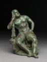 Figure of the hero god Heracles with his club seated on a lion (EA1999.31)