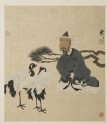 Zhi Dun sitting in front of two cranes