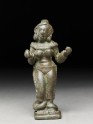 Female figure with heavy anklets