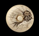Manjū netsuke depicting the Earth Spider in a web