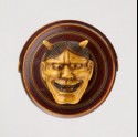 Manjū netsuke in the form of a temple gong and Hannya mask from the Nō play 'Dōjōji' (EA2001.118)