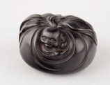 Manjū netsuke in the form of Hotei peering from his sack