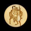 Manjū netsuke depicting a child riding a sacred deer
