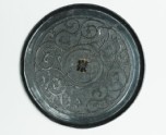 Ritual mirror with scrolling interlace decoration