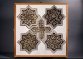 Set of five tiles in the shapes of stars and a cross